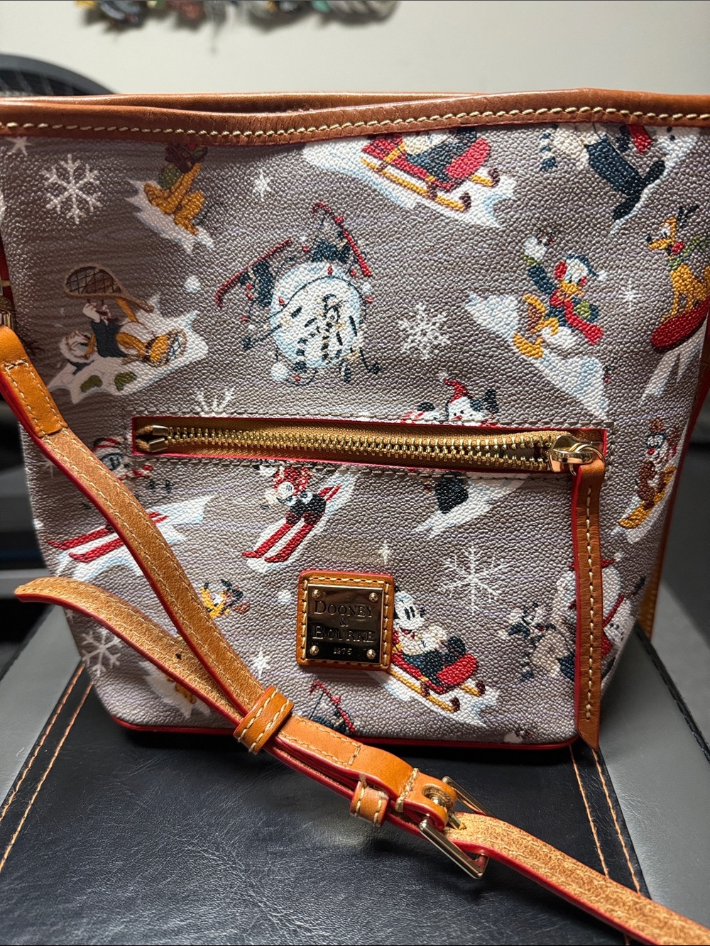 Dooney & Bourke Tan Holiday Ski Print Crossbody Bag with Orange Leather Trim